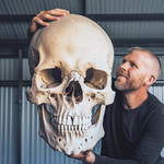 Niklaus699_man_holding_giant_skull_7b414cb1-4056-48ff-8ba9-1f03f935f4e4.png